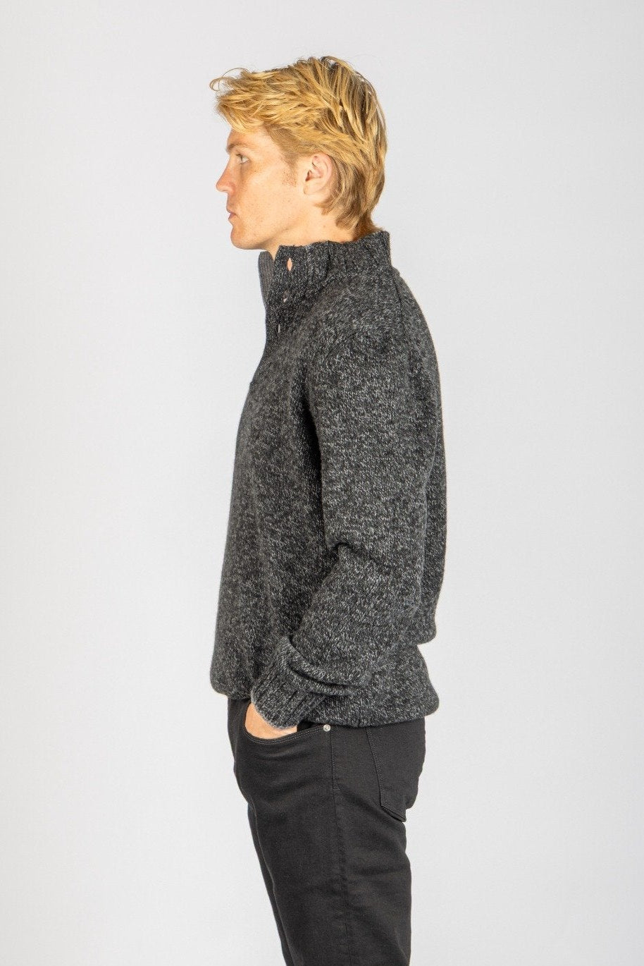 Side view of charcoal marl wool button neck jumper with button collar