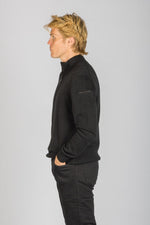 Side profile of black quarter zip wool-cashmere jumper showing sleeve embroidery