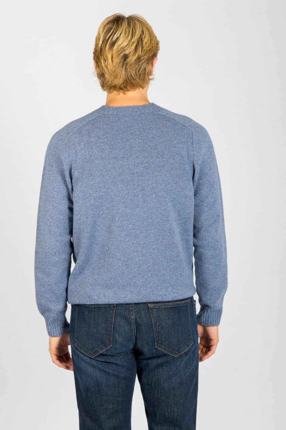 Back view of sky blue wool crew neck jumper with ribbed hem