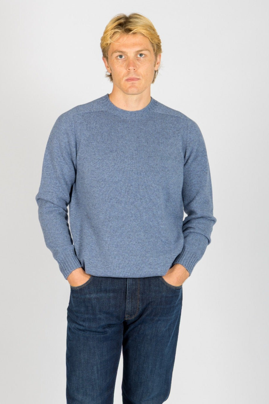 Front view of Featherstone London sky blue wool crew neck jumper with embroidered logo