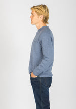 Side view of sky blue wool crew neck jumper with embroidered logo