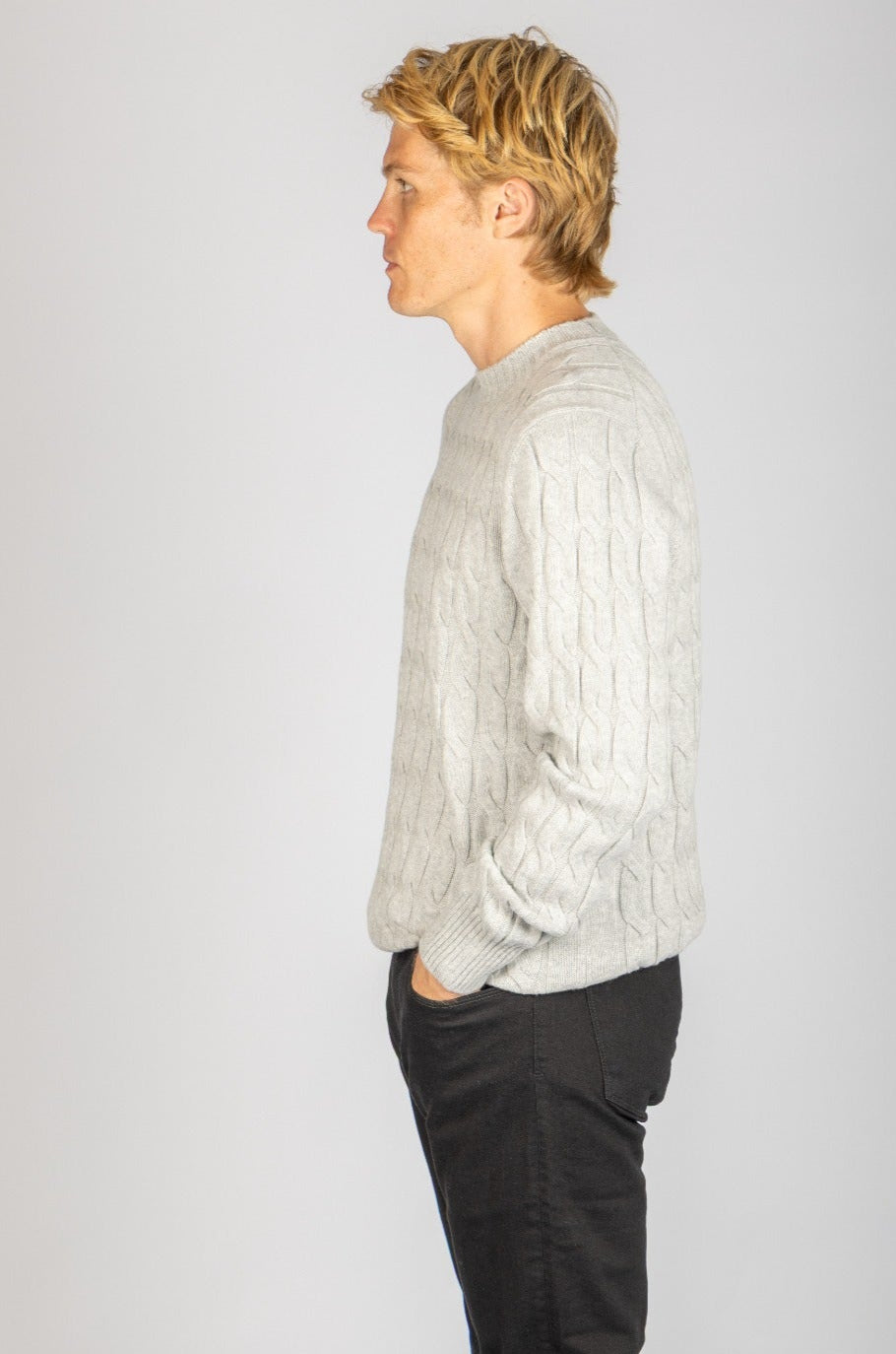 Side profile of light grey wool-cashmere blend cable knit jumper