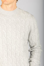 Close-up of cable knit texture on light grey wool-cashmere blend jumper
