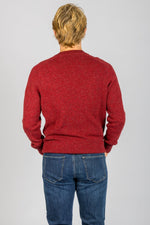 Back view of red marl wool crew neck jumper with ribbed hem