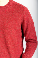 Close-up of red marl knit texture on wool jumper