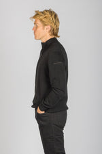 Side profile of black quarter zip wool-cashmere jumper showing sleeve embroidery