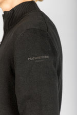 Close-up of funnel neck, metal zip and embroidered sleeve logo