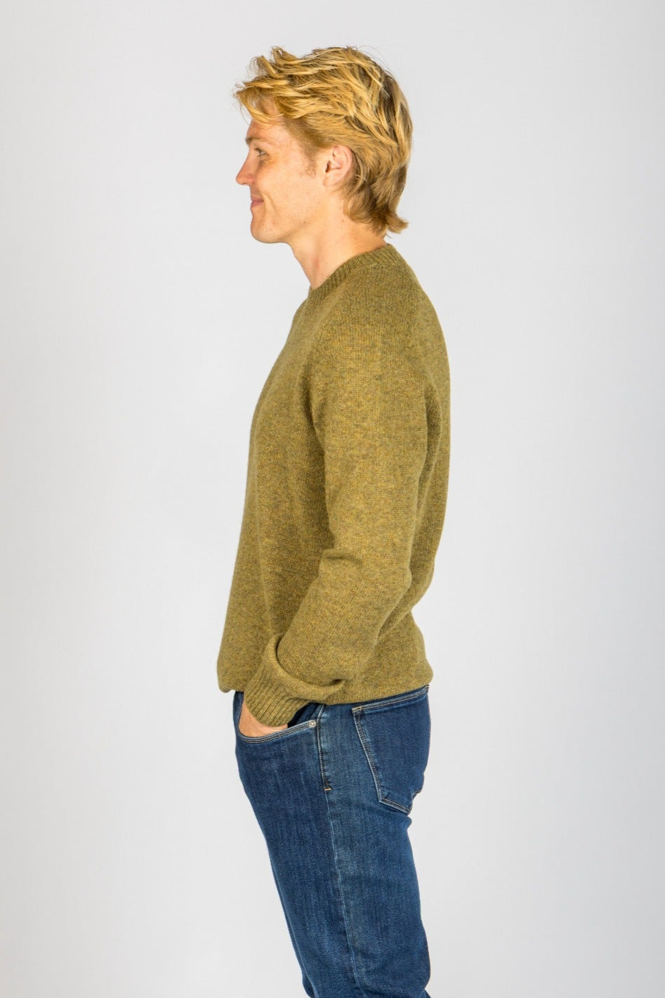 Side profile of moss marl wool crew neck jumper