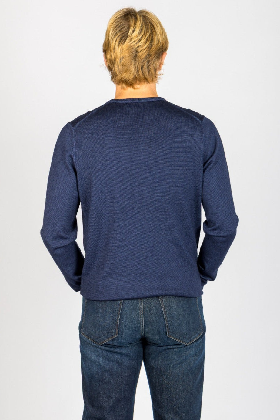 Back view of navy wool crew neck jumper with ribbed hem